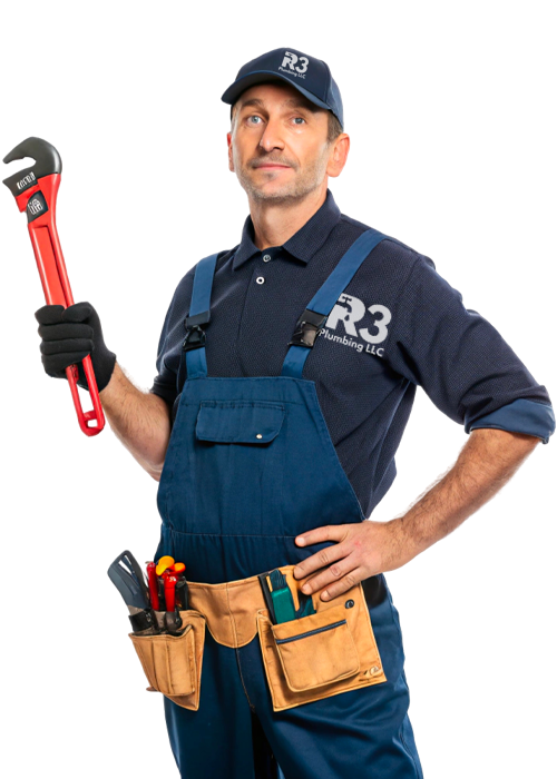 Plumber using an adjustable wrench to tighten fittings on a water heater